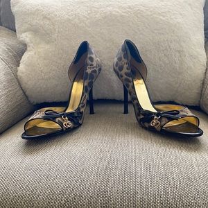 Guess Cheetah print peep toe heels.